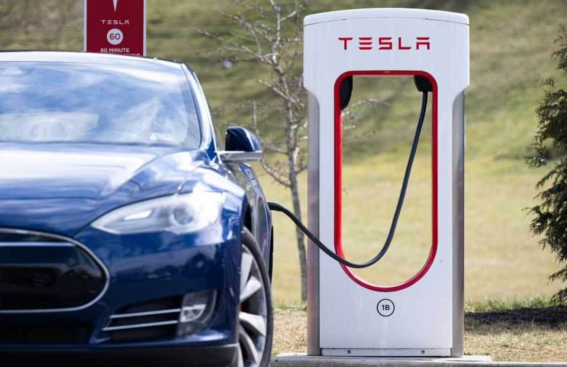 A Tesla Model S sedan is plugged into a charging station in Falls Church, Virginia A Tesla Model S sedan is plugged into a charging station in Falls Church, Virginia
