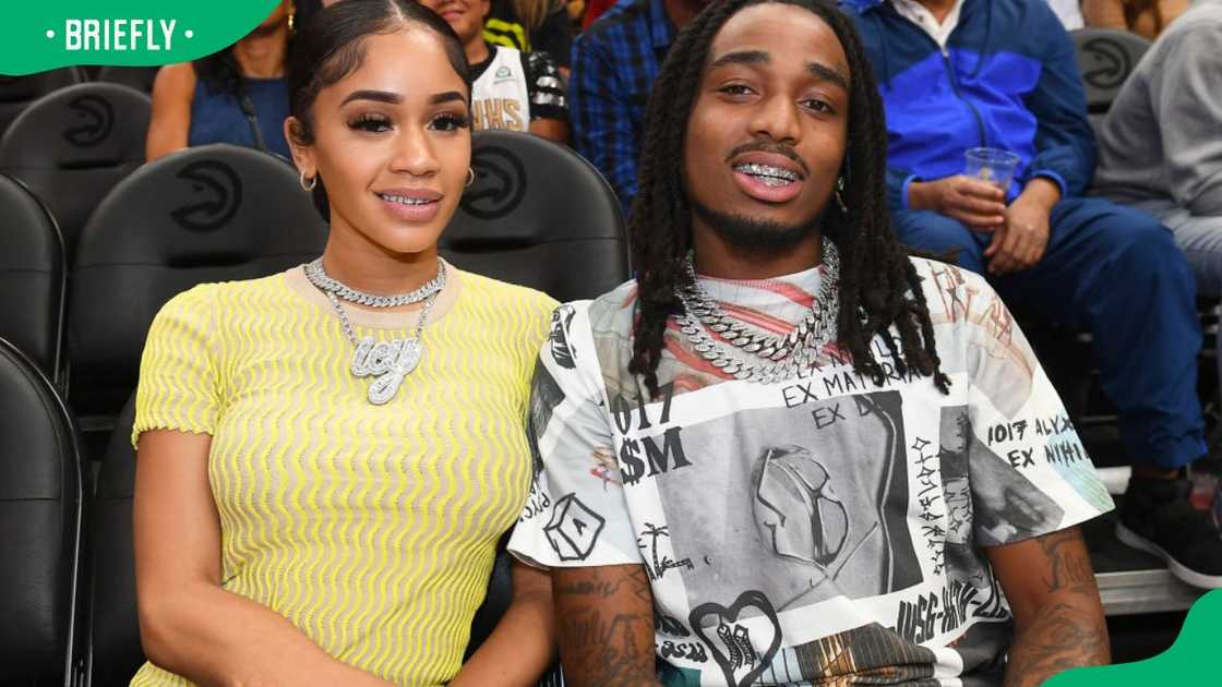Saweetie and Quavo during a 2019 NBA game at the State Farm Arena Saweetie and Quavo during a 2019 NBA game at the State Farm Arena