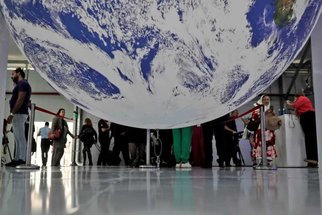 Participants tour the Sharm el-Sheikh International Convention Centre, in Egypt's Red Sea resort city of the same name, during the COP27 climate conference Participants tour the Sharm el-Sheikh International Convention Centre, in Egypt's Red Sea resort city of the same name, during the COP27 climate conference