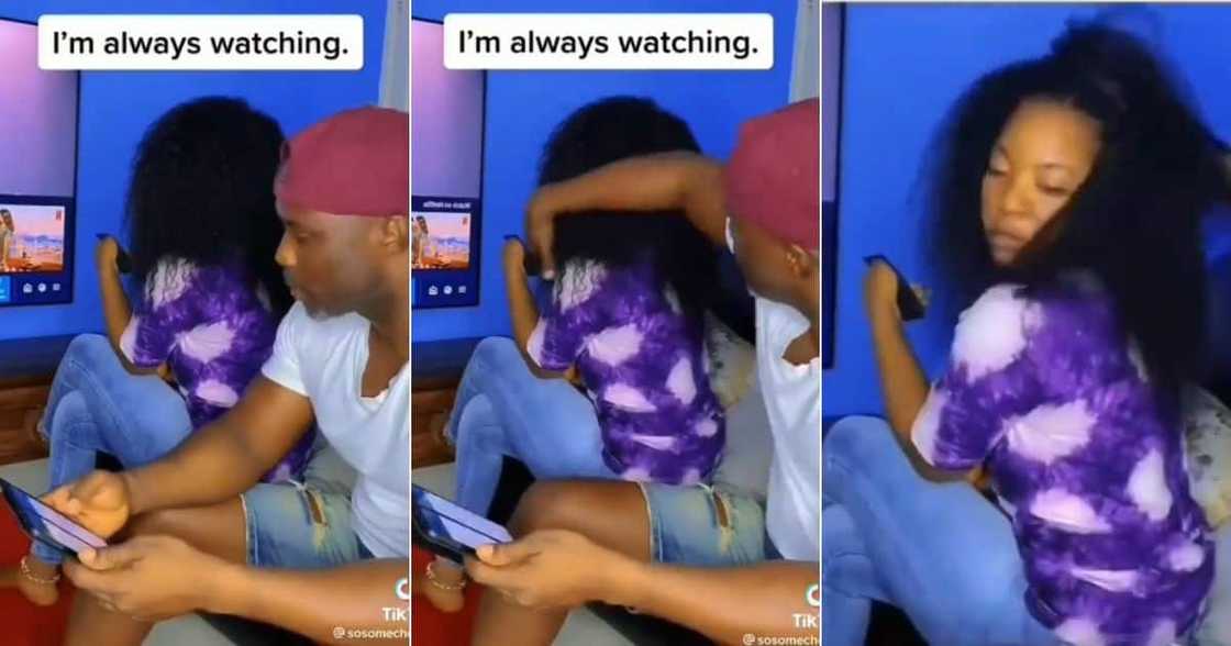 Woman watching boyfriend through wig Woman watching boyfriend through wig