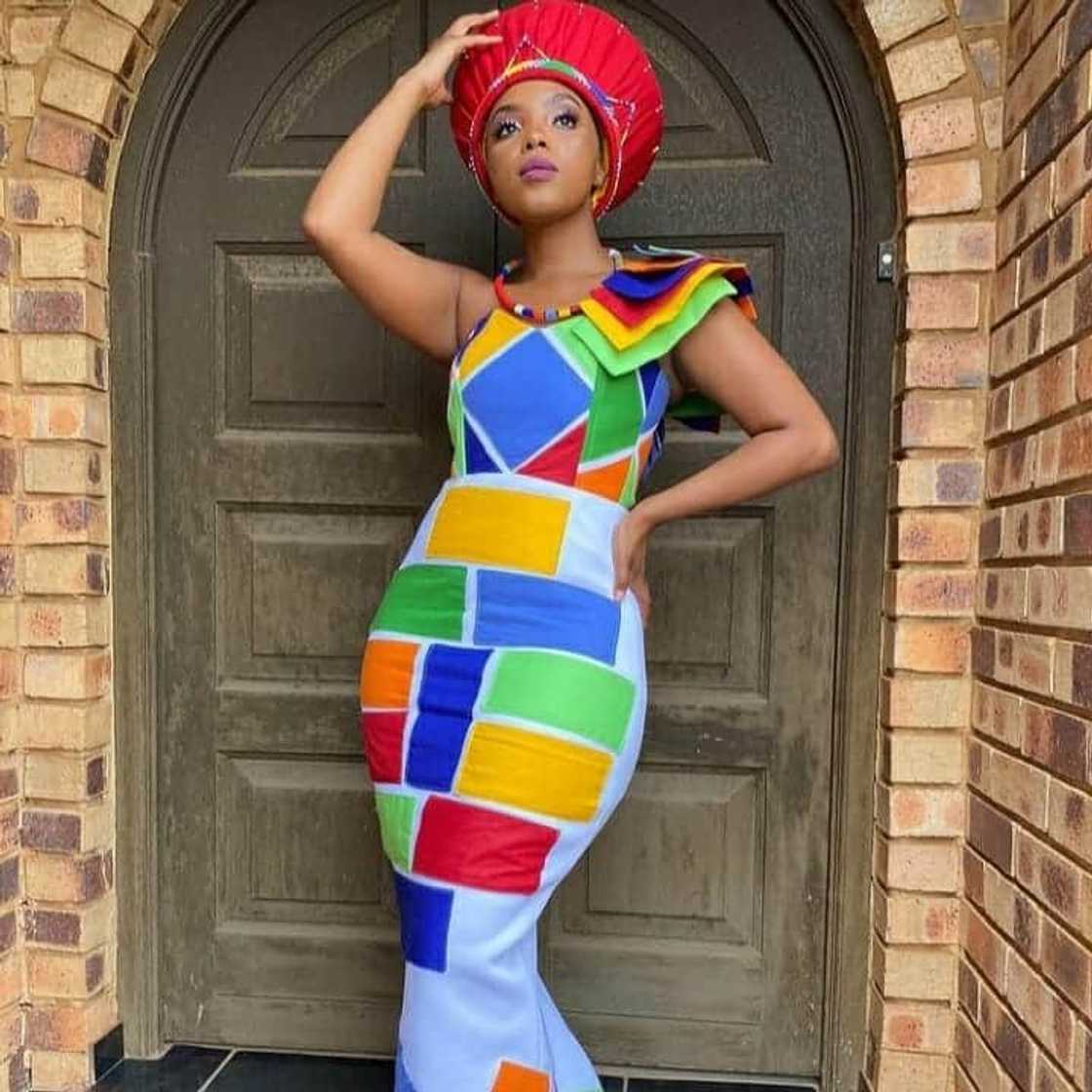 Colourful patches on a white dress Colourful patches on a white dress
