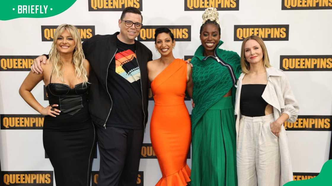 Bebe Rexha, Aron Gaudet, Gita Pullapilly, Kirby Howell-Baptiste and Kristen Bell during the Queenpins Photo Call in 2021 (L-R) Bebe Rexha, Aron Gaudet, Gita Pullapilly, Kirby Howell-Baptiste and Kristen Bell during the Queenpins Photo Call in 2021 (L-R)