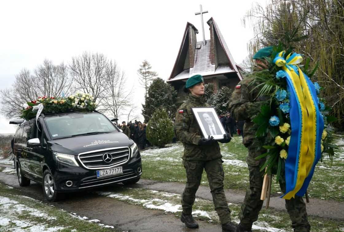 Polish soldiers lead the funeral cortege on Saturday Polish soldiers lead the funeral cortege on Saturday
