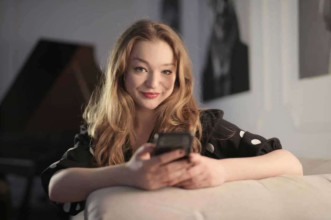 A woman using a smartphone A woman using a smartphone
