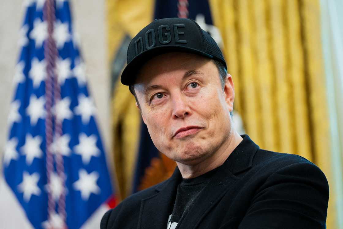 Elon Musk looks on during a news conference with US President Donald Trump in the Oval Office of the White House in Washington, DC