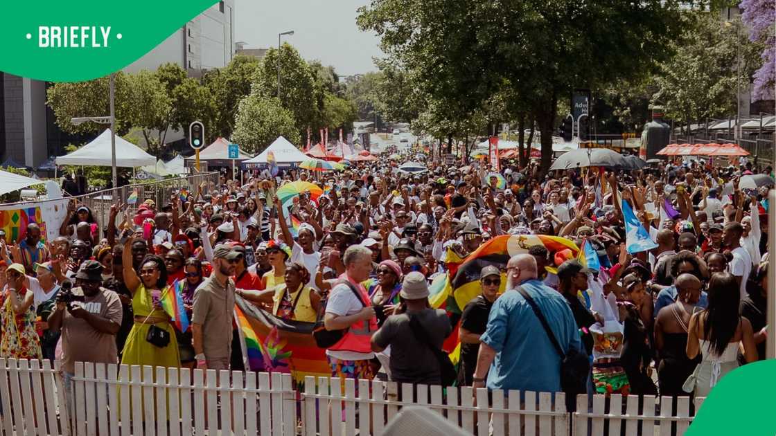 People attending a Pride event. People attending a Pride event.