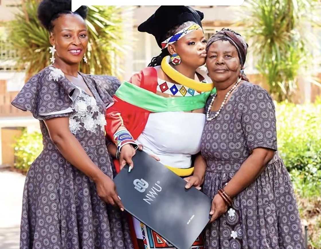 A woman in South Africa with her grandmother on her graduation day. A woman in South Africa with her grandmother on her graduation day.