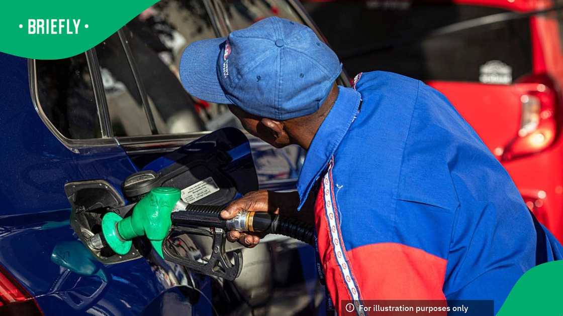 A petrol attendant fills a car withl on March 31, 2026 in Cape Town, South Africa