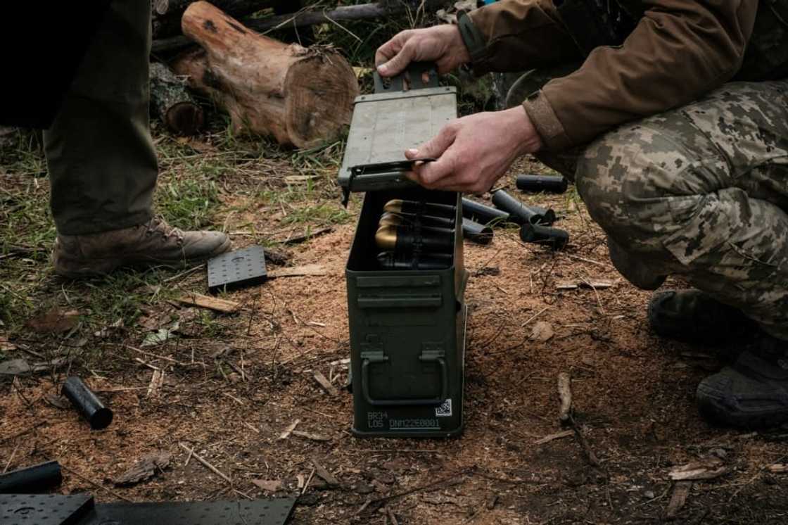 Soldiers of Ukraine's 5th Regiment of Assault Infantry put ammunition into a crate before setting a US-made MK-19 automatic grenade launcher towards Russian positions in less than 800 metres away at a front line near Toretsk in the Donetsk region Soldiers of Ukraine's 5th Regiment of Assault Infantry put ammunition into a crate before setting a US-made MK-19 automatic grenade launcher towards Russian positions in less than 800 metres away at a front line near Toretsk in the Donetsk region