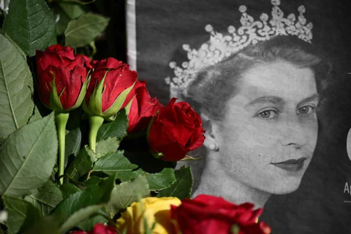 Flowers laid by well-wishers outside  Holyroodhouse Palace in Edinburgh, where the queen's coffin will be taken