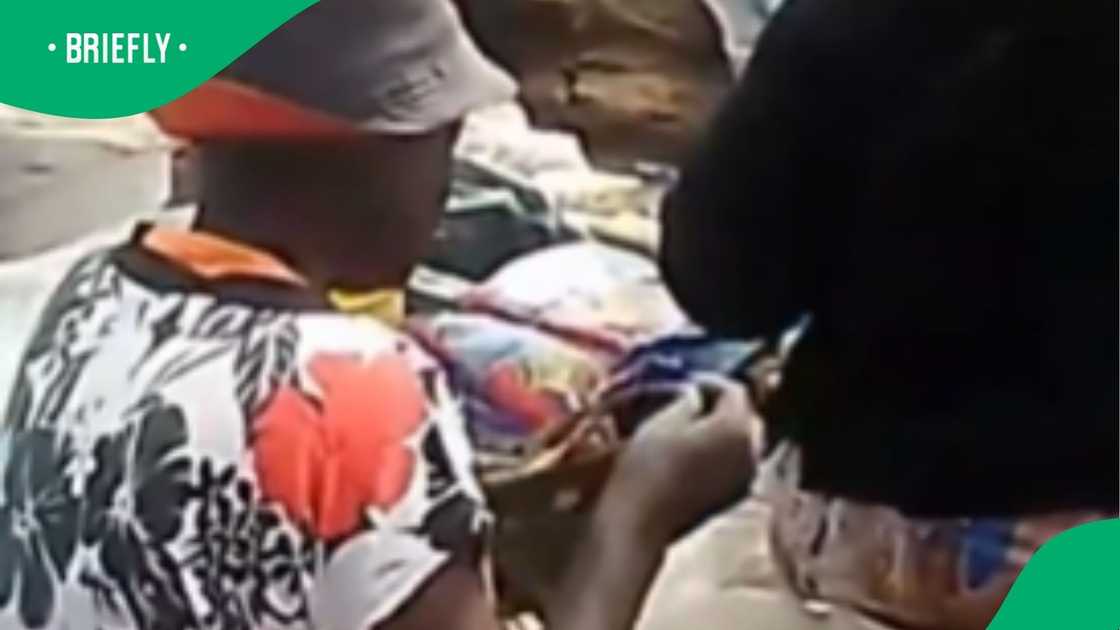 The woman was feeding a mystery animal in front of people