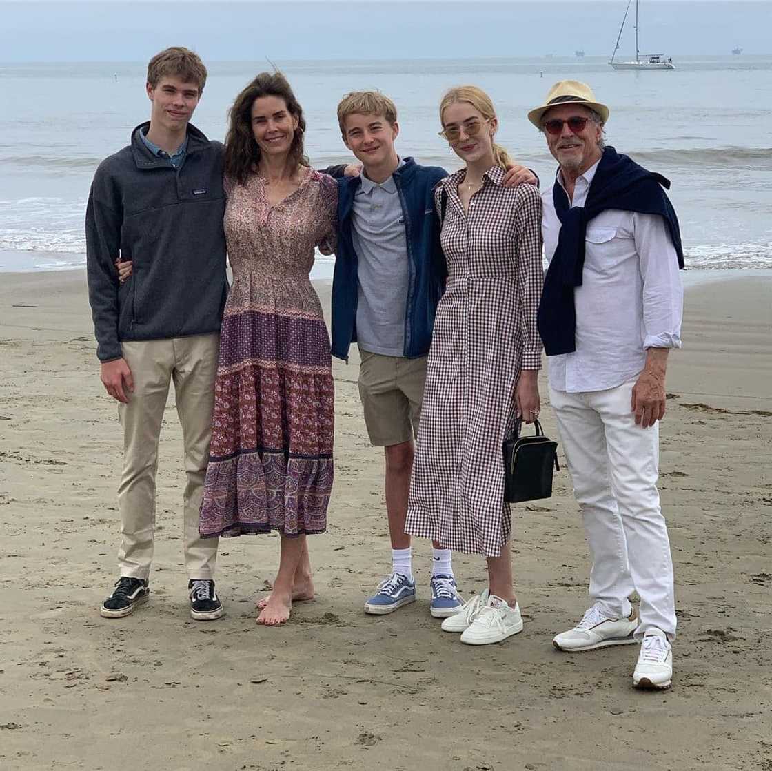 Kelley Phleger, Don Johnson, and their children posing for a photo at the beach Kelley Phleger, Don Johnson, and their children posing for a photo at the beach