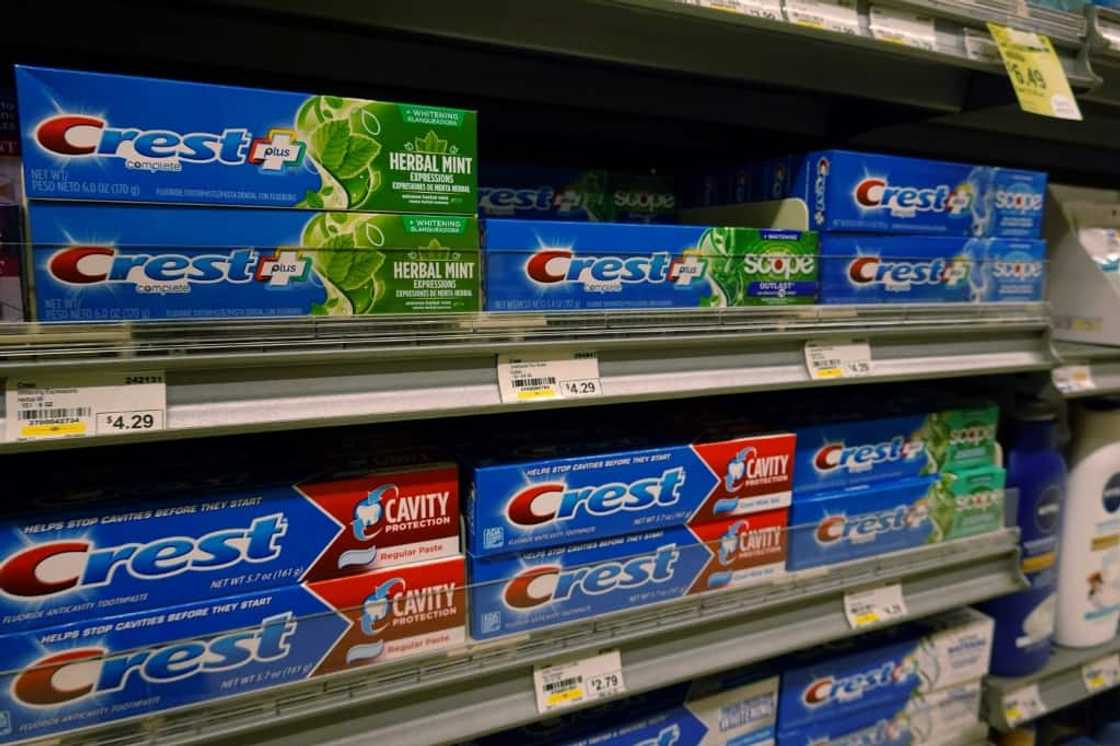 Procter & Gamble, which makes Crest toothpaste and other household items, reported solid profits, lifting shares