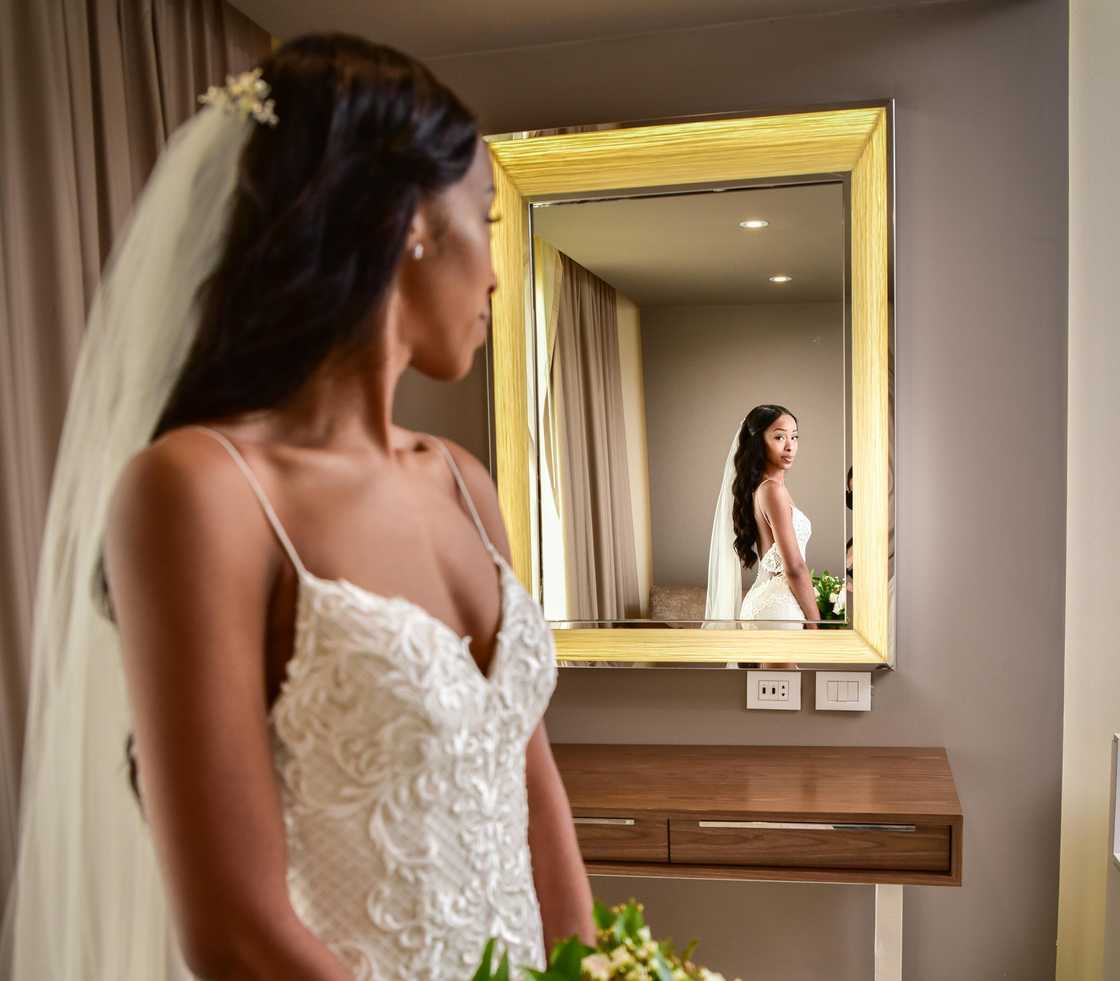 Bride looking at the mirror Bride looking at the mirror