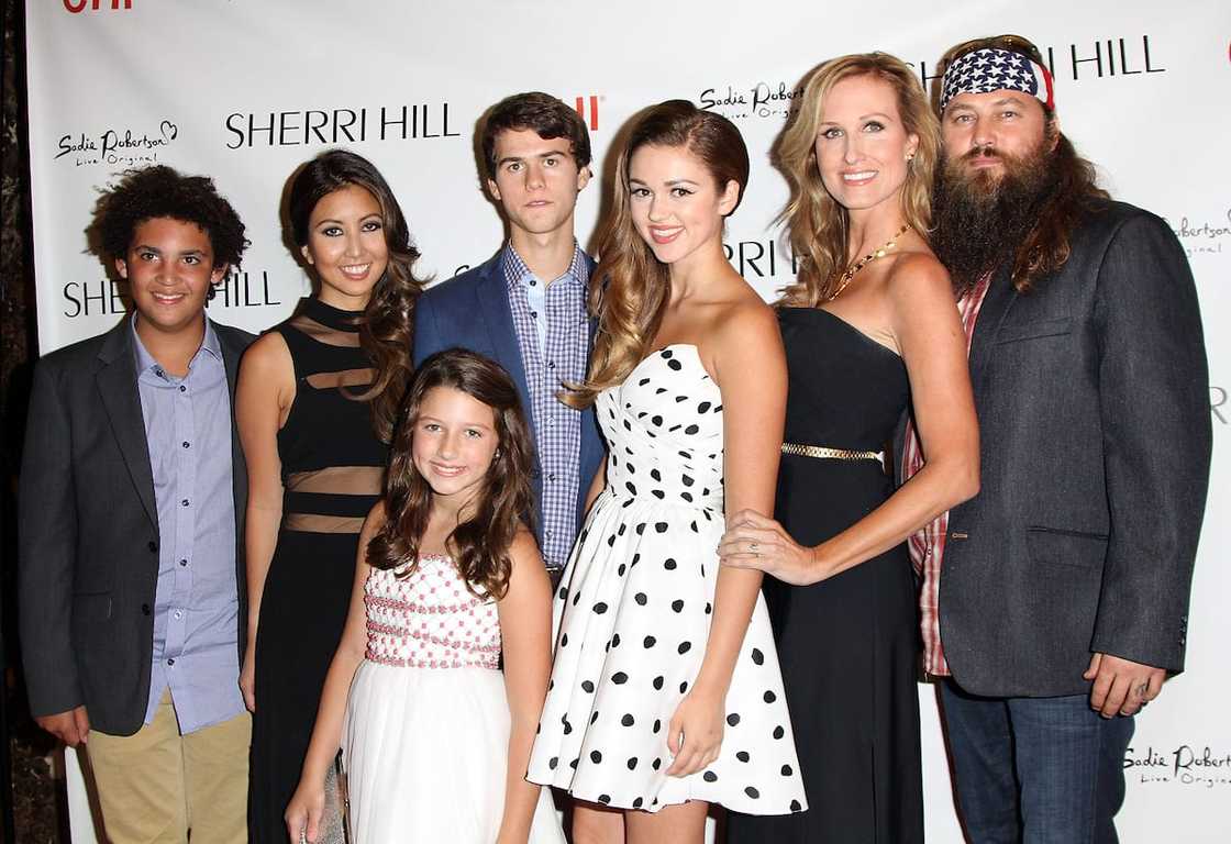 Will Jr, Rebecca Robertson, Bella, John Luke, Sadie, Korie, and Willie Robertson (left to right) in 2013. Will Jr, Rebecca Robertson, Bella, John Luke, Sadie, Korie, and Willie Robertson (left to right) in 2013.