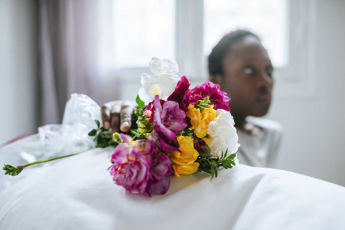A patient receives flowers A patient receives flowers