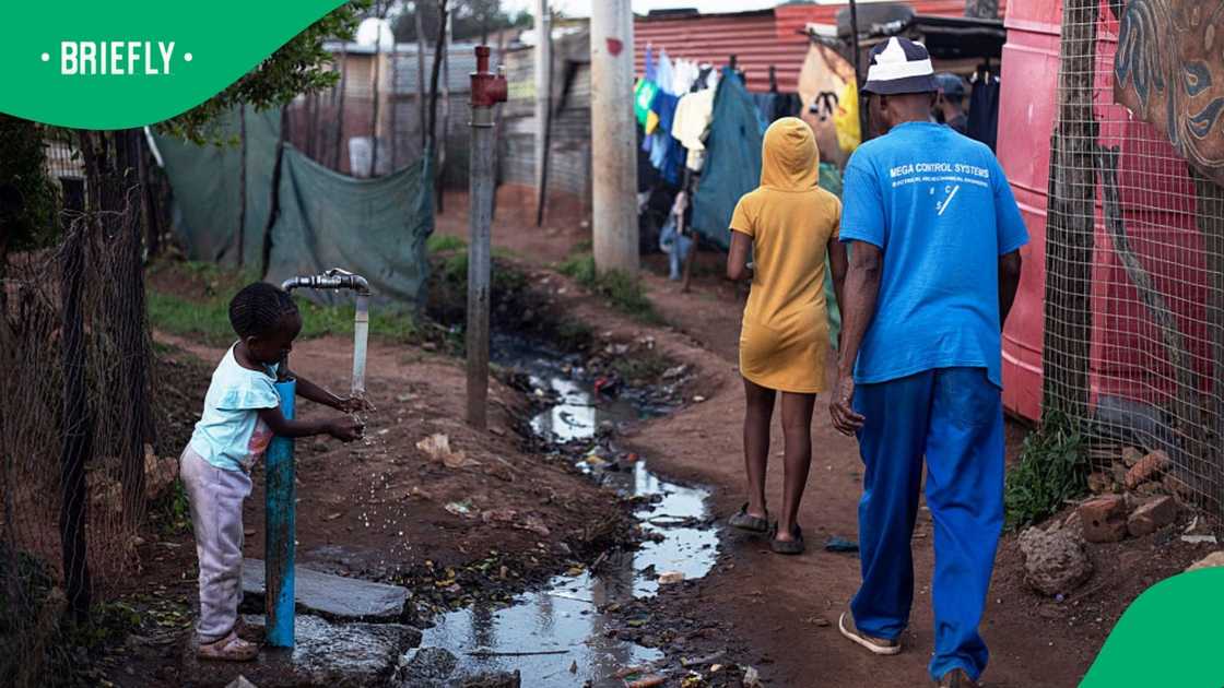 A child washes her hands in a communal tap outside her house on May 4, 2026, in Sicelo Township in Meyerton A child washes her hands in a communal tap outside her house on May 4, 2026, in Sicelo Township in Meyerton