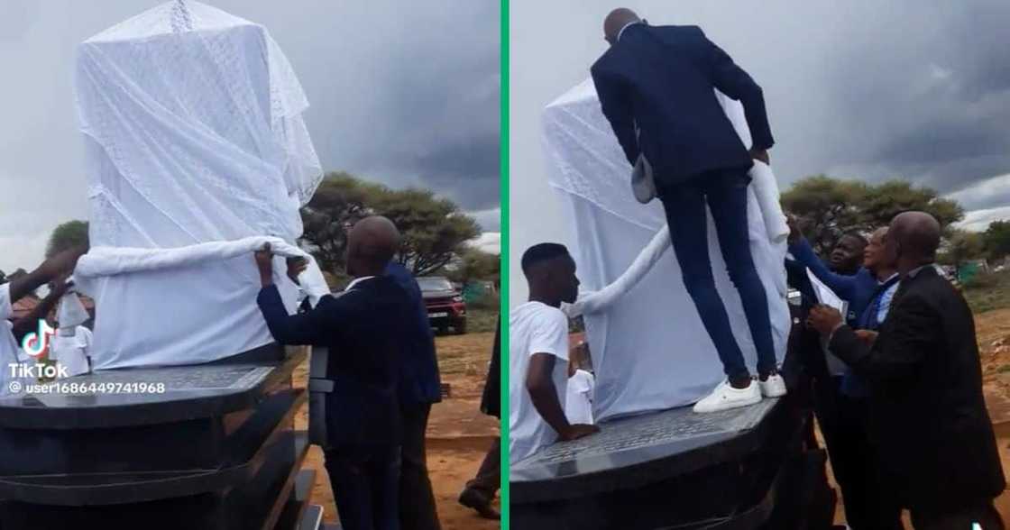 A group of men tried to uncover a big tombstone A group of men tried to uncover a big tombstone