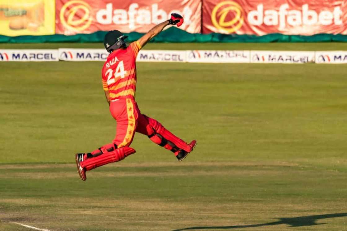 Sikandar Raza celebrates scoring a century for Zimbabwe during a one-day international against Bangladesh in Harare on August 5, 2022.