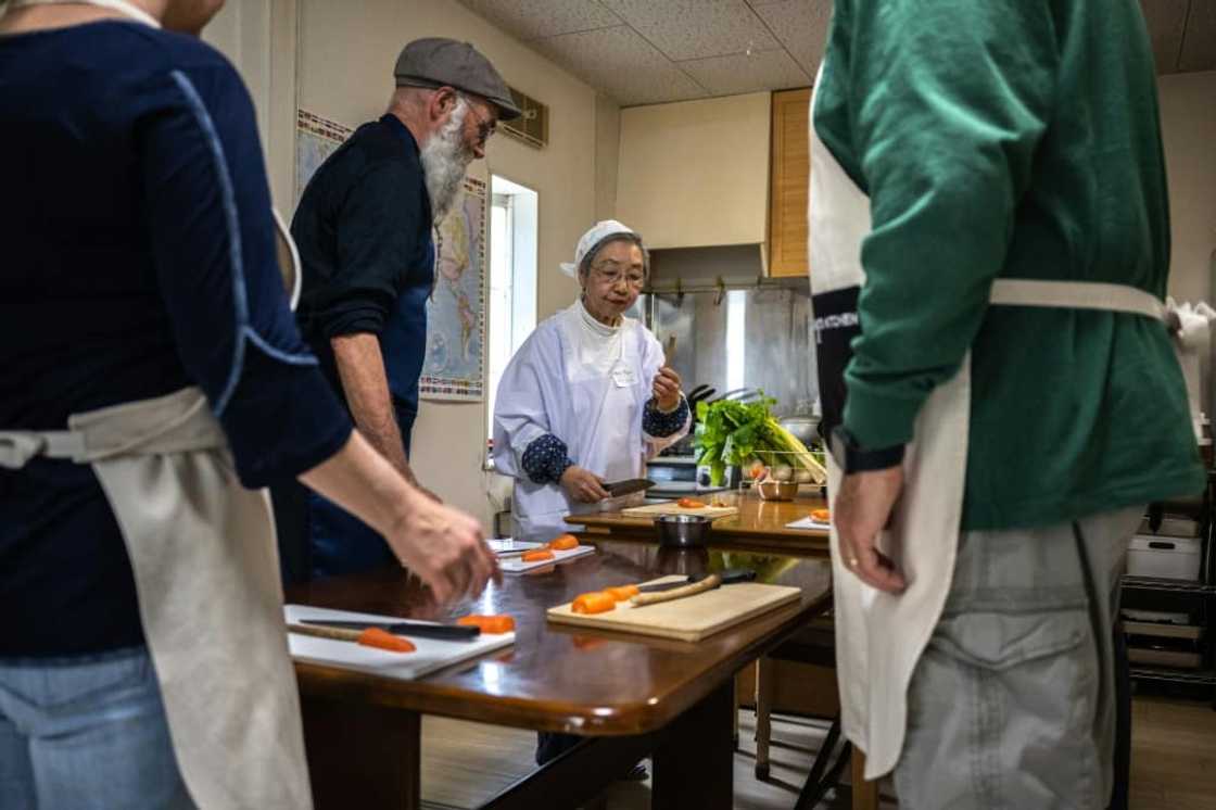 "Shojin ryori" specialist Mari Fujii (C) leads workshops on how to cook traditional Buddhist vegetarian cuisine "Shojin ryori" specialist Mari Fujii (C) leads workshops on how to cook traditional Buddhist vegetarian cuisine