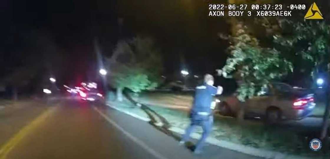 This image captured from a police officer's body camera and provided by the Akron Police Department on July 3, 2022, shows a police officer approaching the vehicle of 25 year old Jayland Walker during a traffic stop in Akron, Ohio, on June 27, 2022 This image captured from a police officer's body camera and provided by the Akron Police Department on July 3, 2022, shows a police officer approaching the vehicle of 25 year old Jayland Walker during a traffic stop in Akron, Ohio, on June 27, 2022