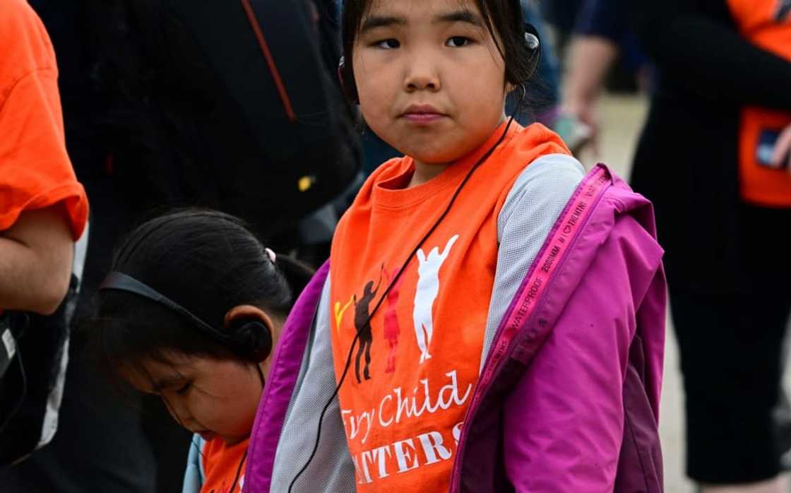 A young girl wearing a shirt reading "Every Child Matters" awaits the arrival of Pope Francis in Iqaluit, Nunavut, Canada, on July 29, 2022 A young girl wearing a shirt reading "Every Child Matters" awaits the arrival of Pope Francis in Iqaluit, Nunavut, Canada, on July 29, 2022
