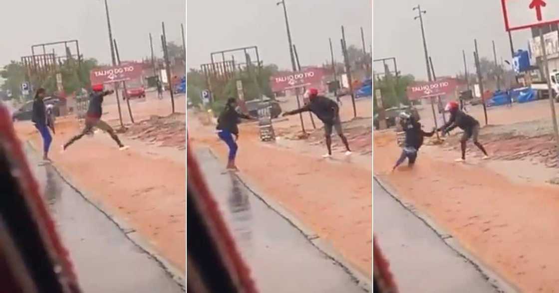 Woman tries to cross flooded Road Woman tries to cross flooded Road