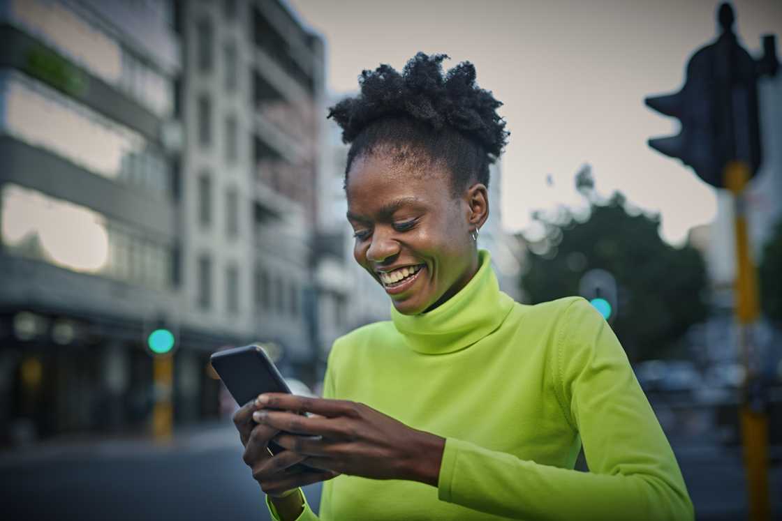 A young woman was pictured smiling at her phone