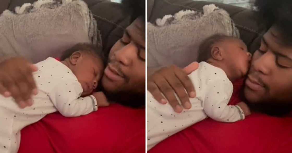 A baby laying on its daddy's chestt sleeping and then kisisng him A baby laying on its daddy's chestt sleeping and then kisisng him