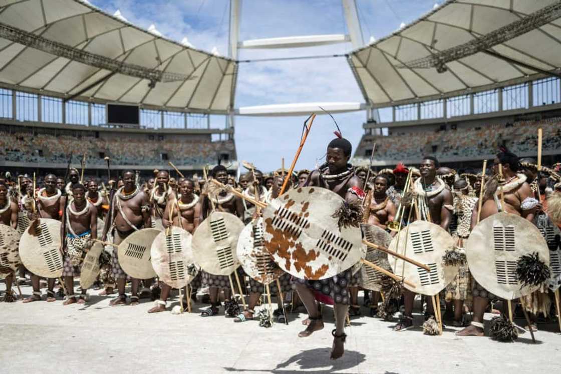 Amabutho, or royal regiments, chanted songs of praise for their king Amabutho, or royal regiments, chanted songs of praise for their king