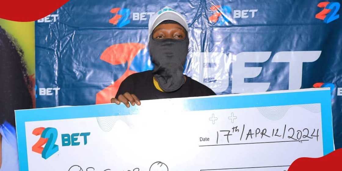 Photo of Christian collecting the dummy cheque. Photo of Christian collecting the dummy cheque.