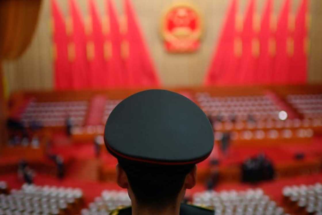 A member of the People's Liberation Army (PLA) band stands before the opening session of the National People's Congress (NPC) at the Great Hall of the People in Beijing on March 5, 2024. A member of the People's Liberation Army (PLA) band stands before the opening session of the National People's Congress (NPC) at the Great Hall of the People in Beijing on March 5, 2024.