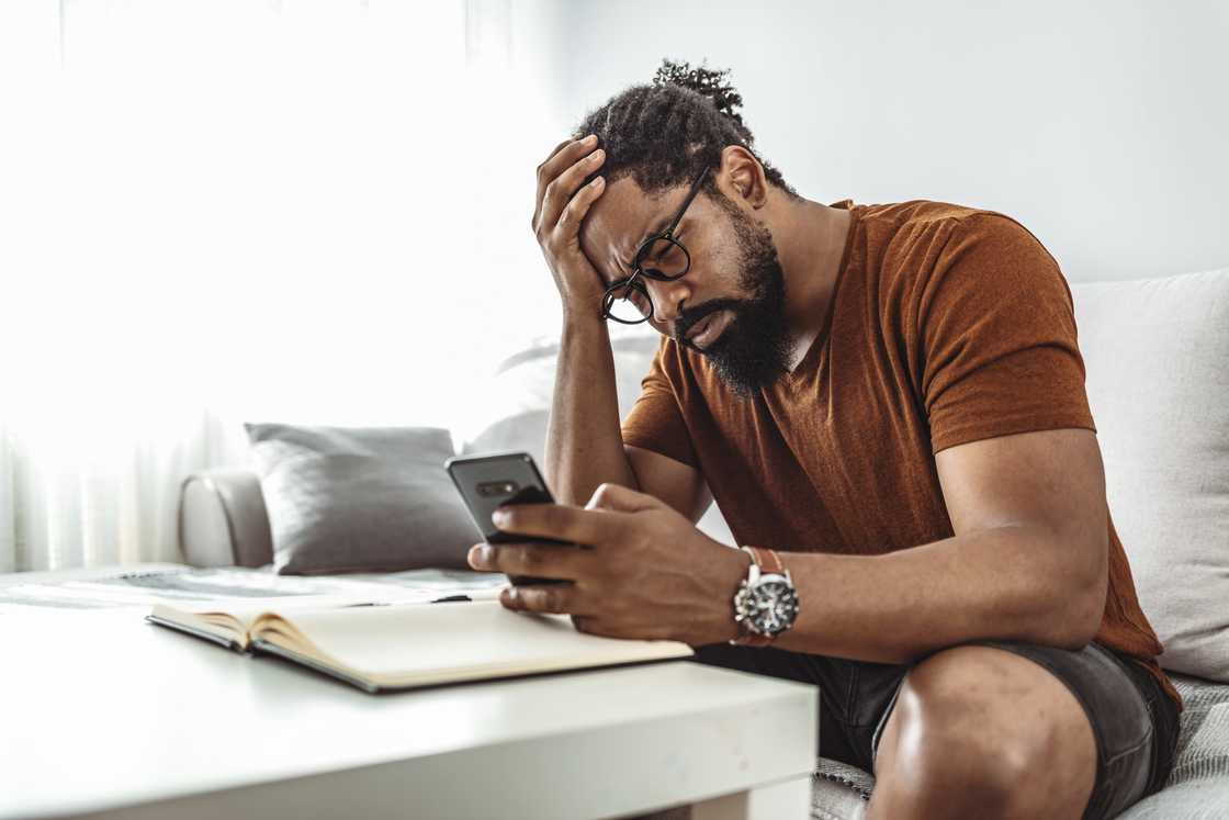 A man is using his phone A man is using his phone