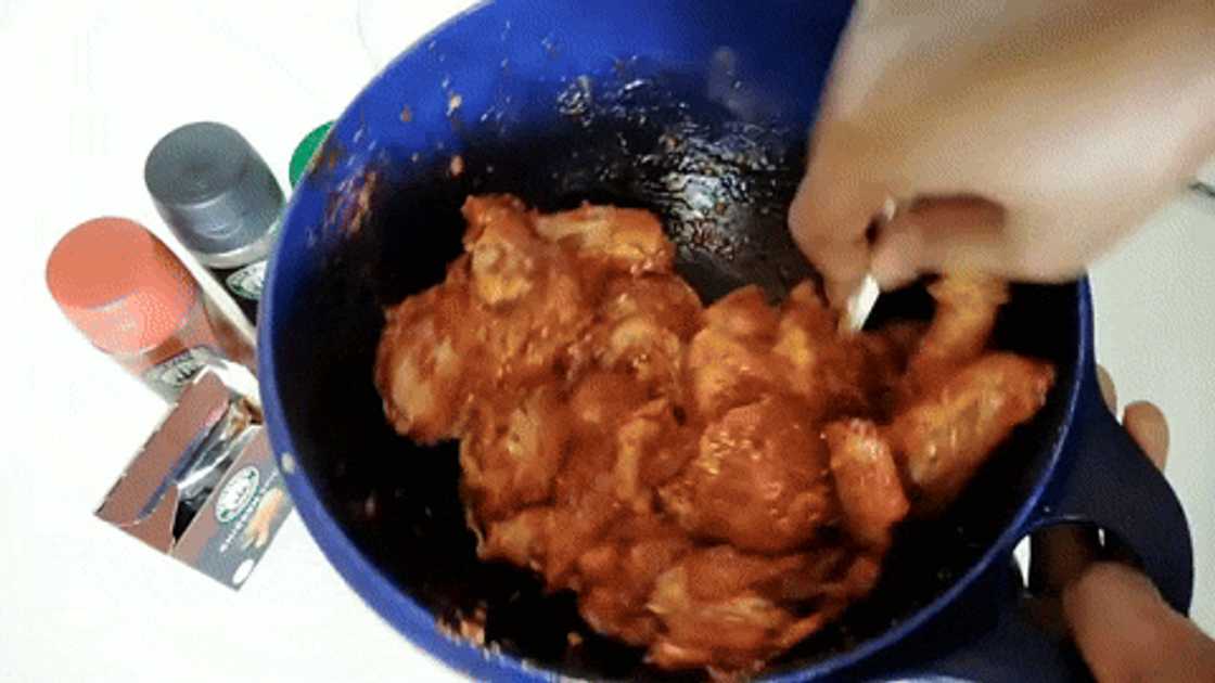 Preparing sticky BBQ chicken wings Preparing sticky BBQ chicken wings