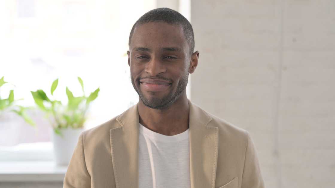 A man smiling while talking A man smiling while talking