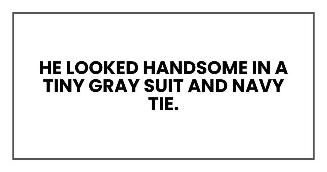 He looked handsome in a tiny gray suit and navy tie.