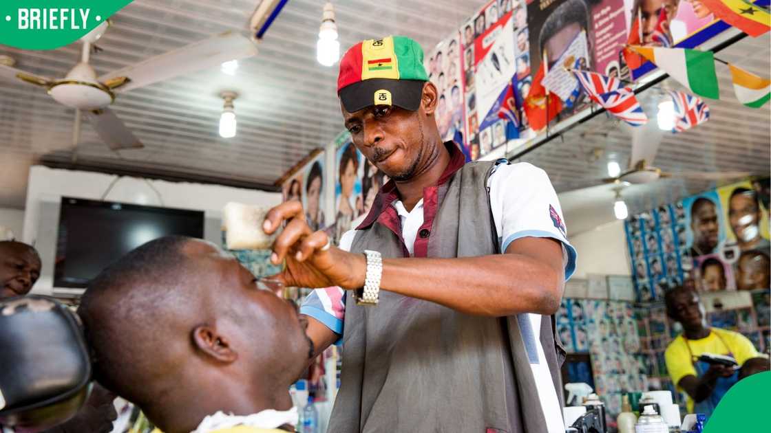 A Ghanaian barber in his store