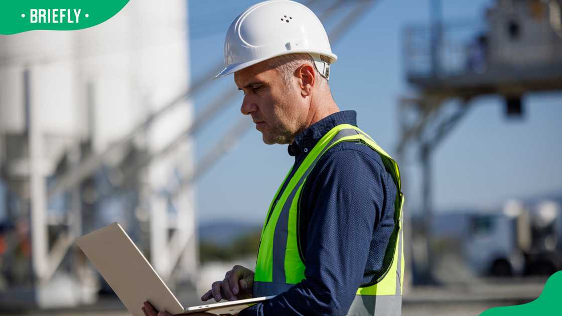 A male engineer working at an industrial facility.