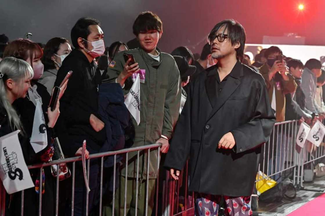 Masayoshi Yokoyama (R) says it is 'imperative' to think about the impact of violent video games on society Masayoshi Yokoyama (R) says it is 'imperative' to think about the impact of violent video games on society