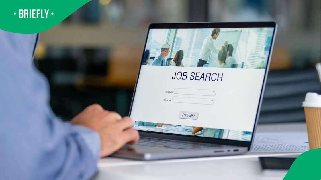 A stock photo of a man browsing for jobs