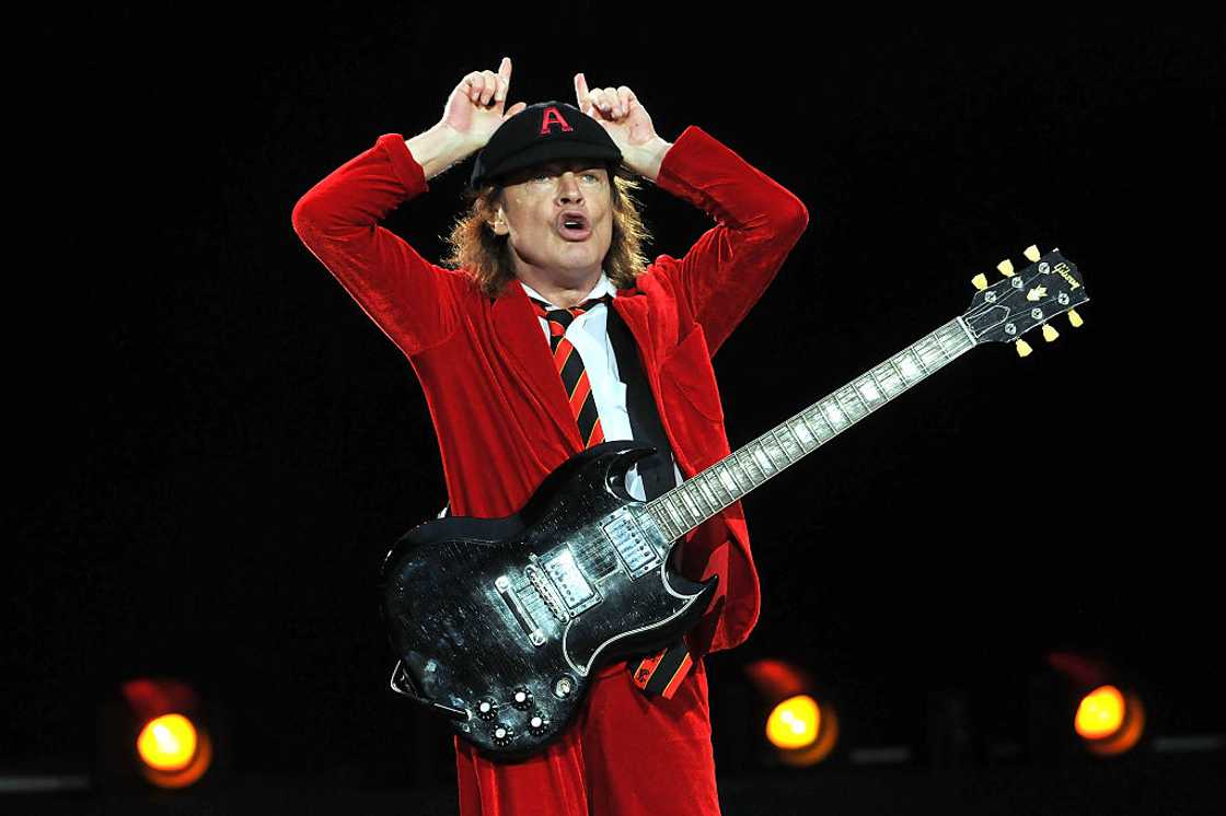 Angus Young of AC/DC performs live on stage Angus Young of AC/DC performs live on stage