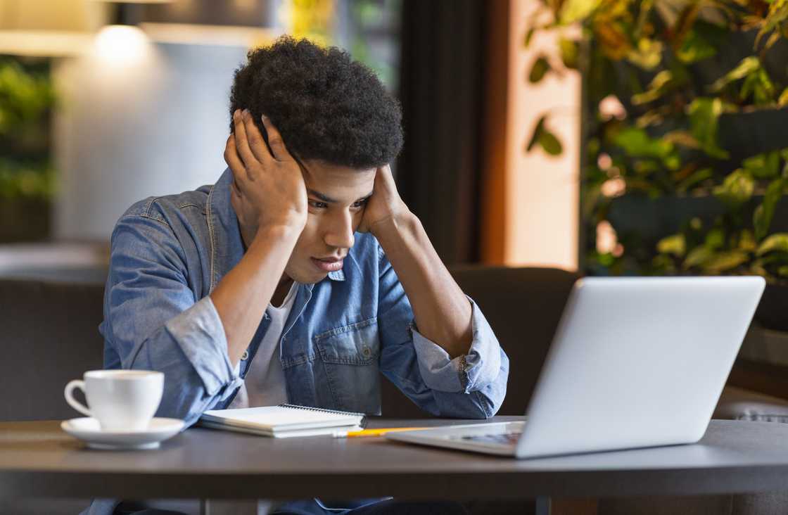 A sad man at a cafe A sad man at a cafe