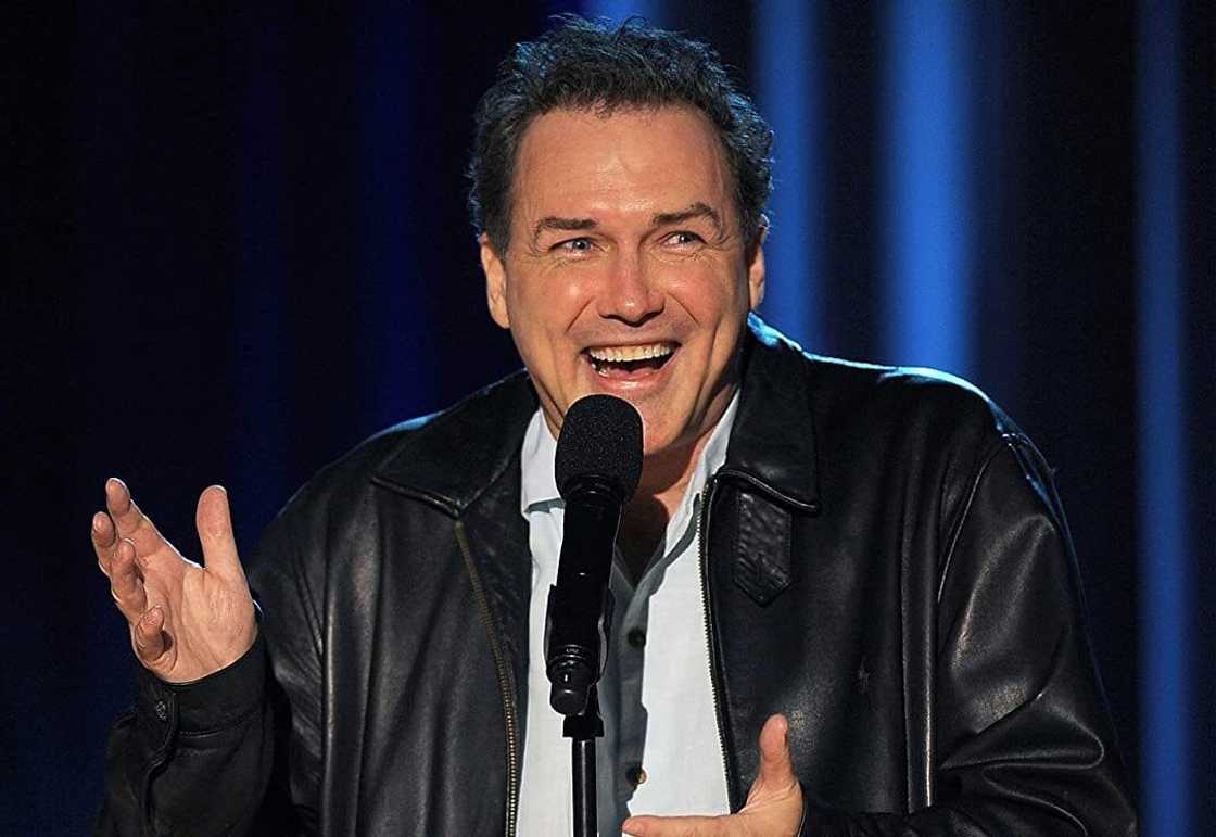 Norm Macdonald on set of one of his stand-up shows. Norm Macdonald on set of one of his stand-up shows.