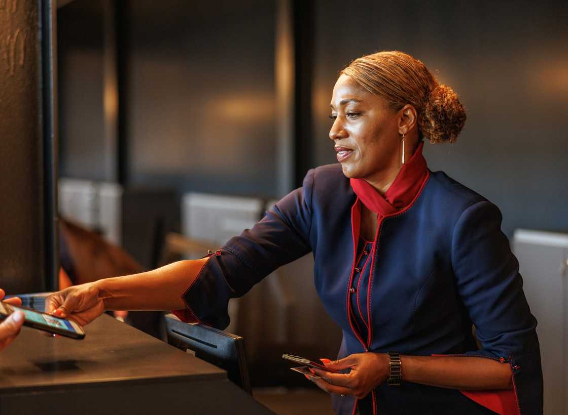 An airport check-in counter with an airline agent.