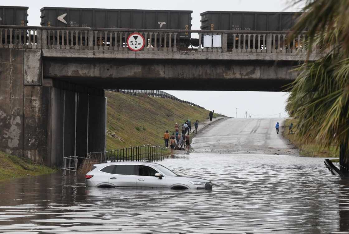 A woman died after her car was washed away during the Durban floods A woman died after her car was washed away during the Durban floods