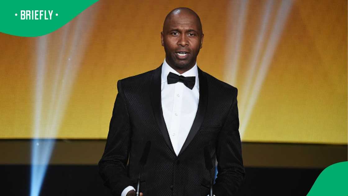 Lucas Radebe gives out an award at the FIFA Ballon d'Or Gala 2015. Lucas Radebe gives out an award at the FIFA Ballon d'Or Gala 2015.
