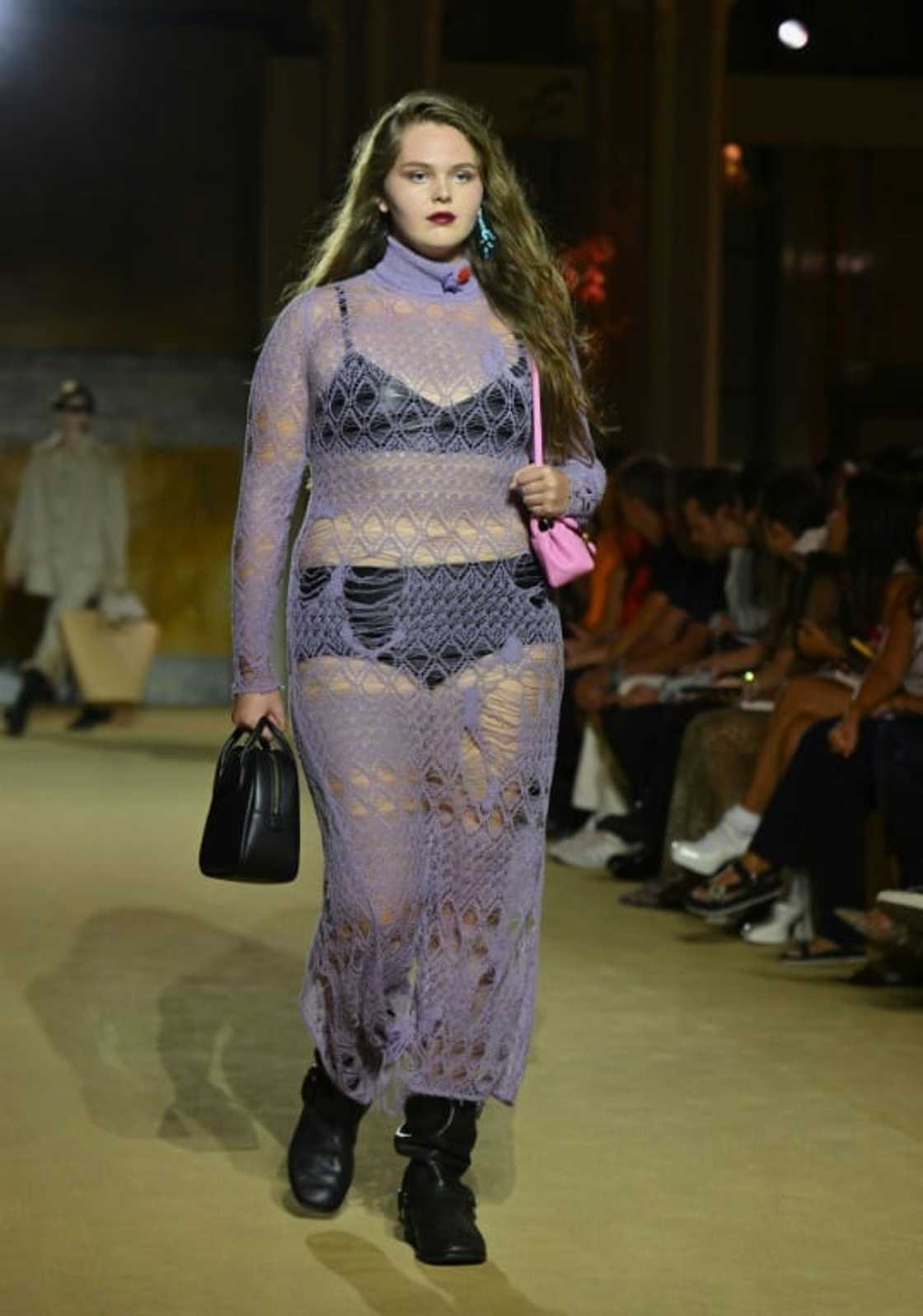A model walks the runway in a Coach dress as part of New York Fashion Week A model walks the runway in a Coach dress as part of New York Fashion Week