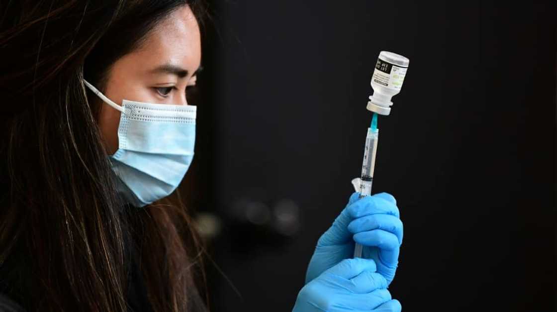 A health worker prepares to administer a vaccine in Los Angeles, California in January 2022 A health worker prepares to administer a vaccine in Los Angeles, California in January 2022