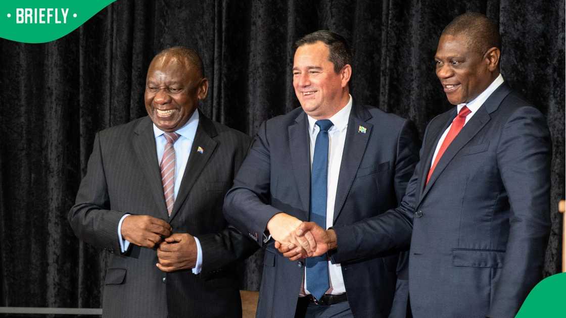John Steenhuisen shakes hands with Deputy President Paul Mashatile, next to President Cyril Ramaphosa