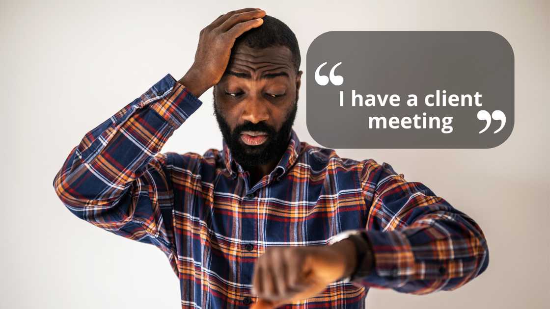 A man looking at his wristwatch A man looking at his wristwatch